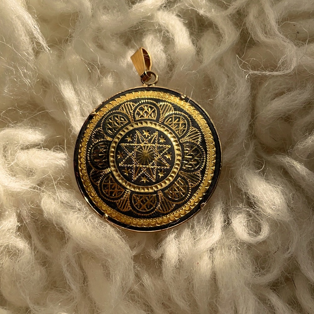 Gold medallion pendant